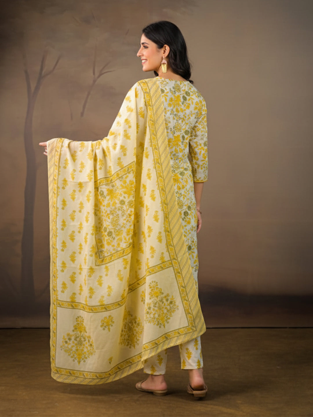 Women's cotton suit set in yellow adorned with Kalamkari prints