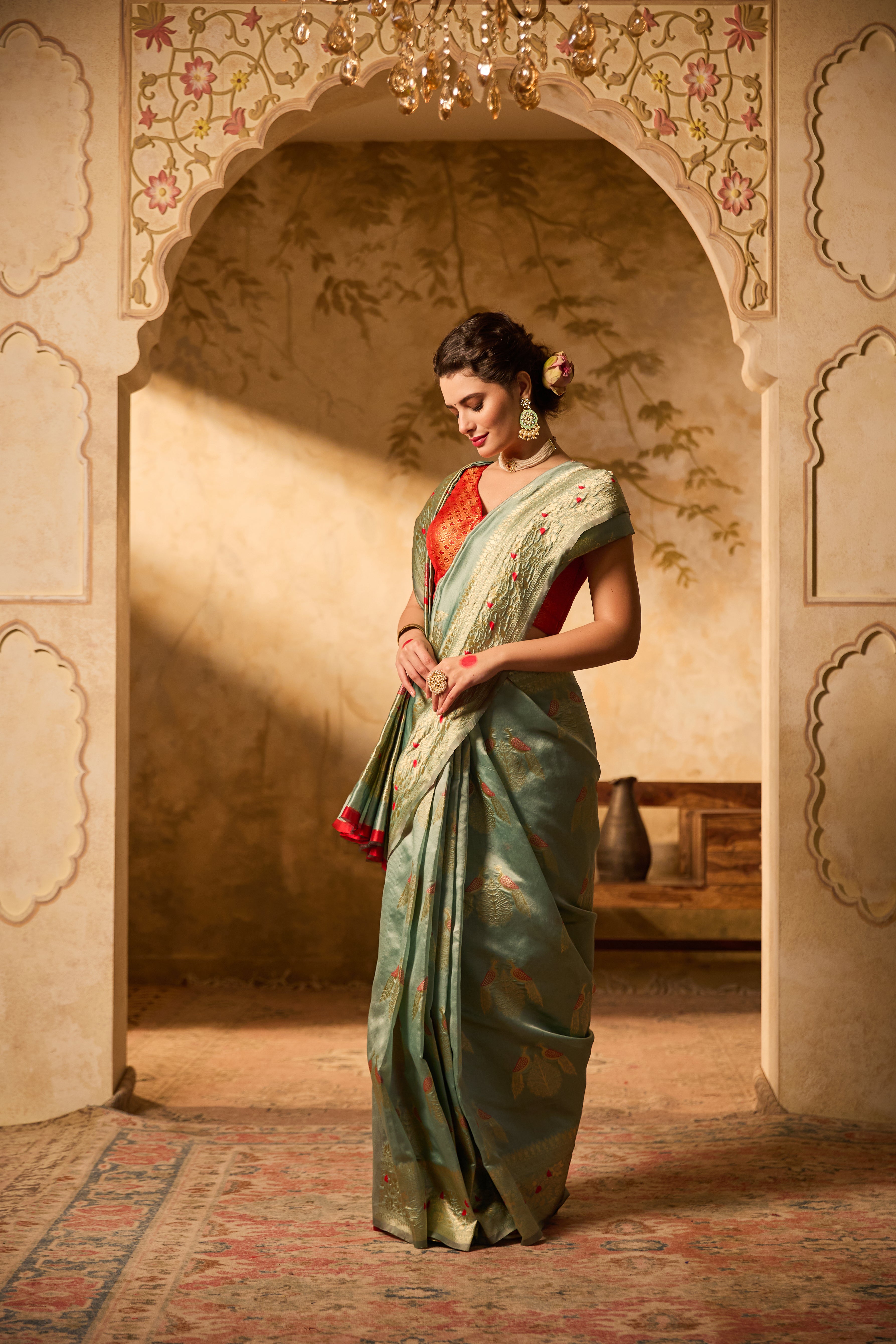 Sea Green Banarasi Silk Saree With Delicate Gold Zari Motifs & Floral Accents
